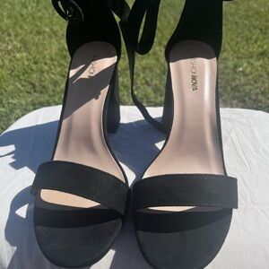 Women’s black heel sandals.